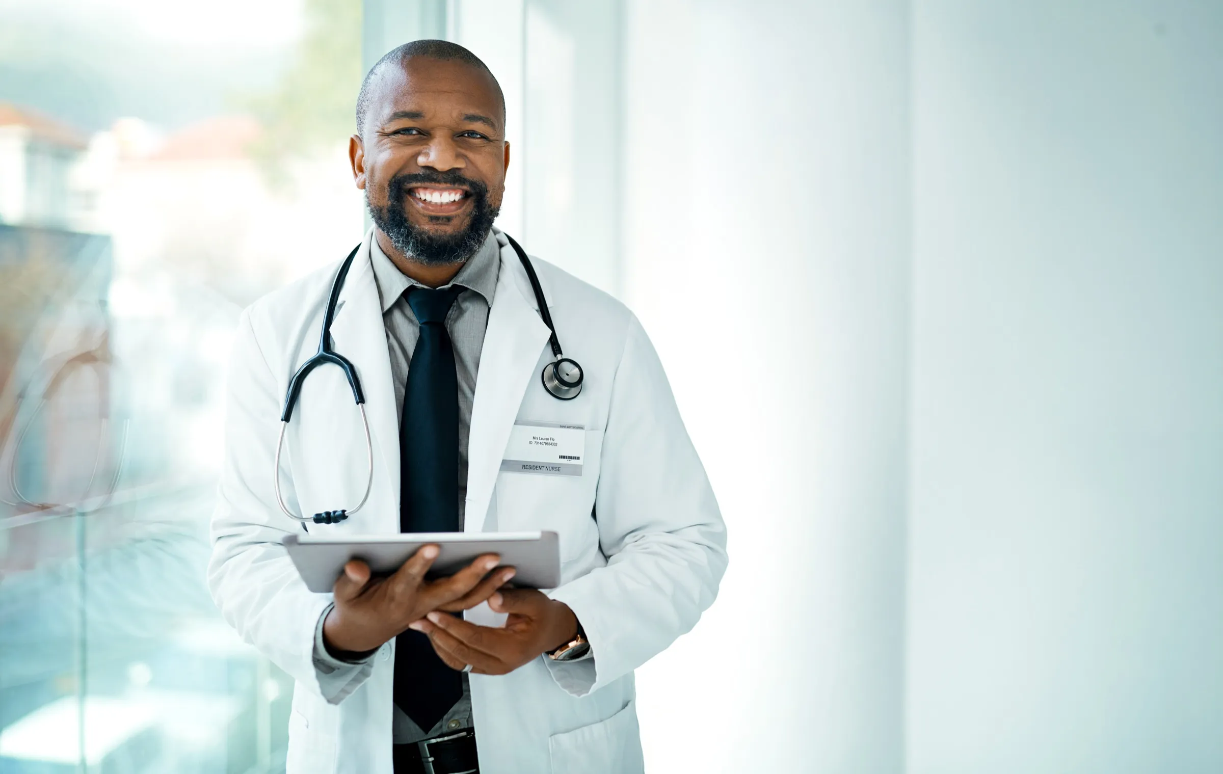 Physician holding a tablet in a clinic