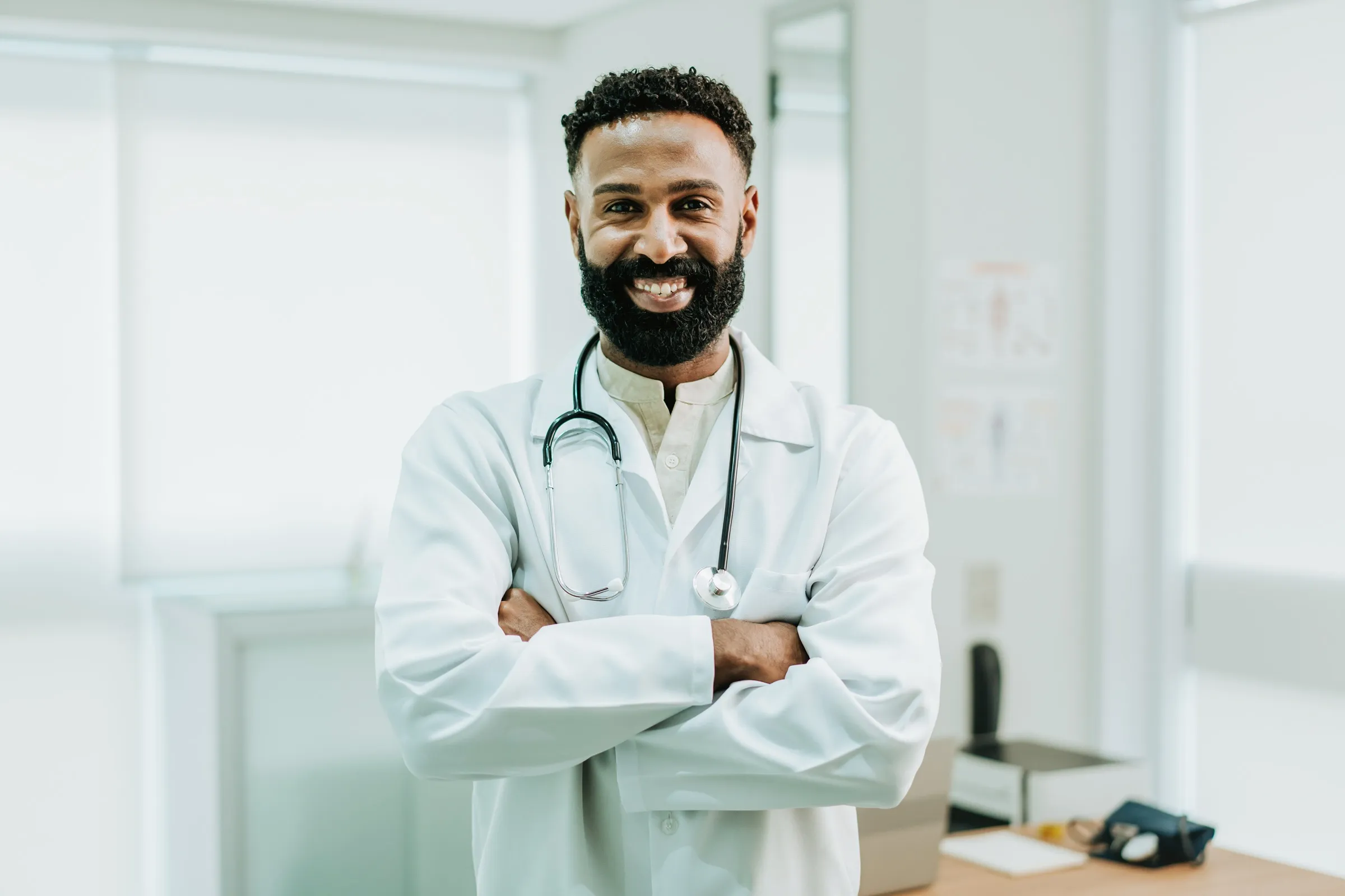 Physician standing in an exam room