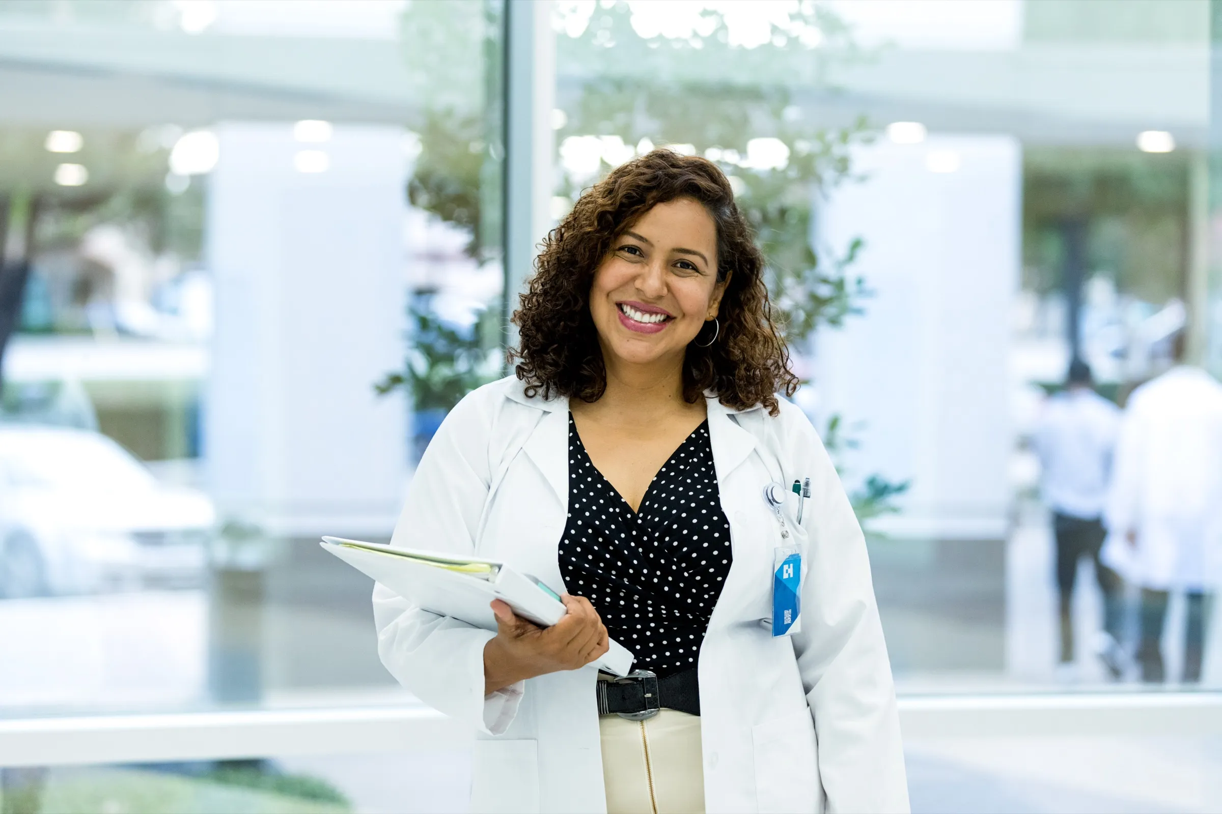 Physician with a tablet outside a medical center