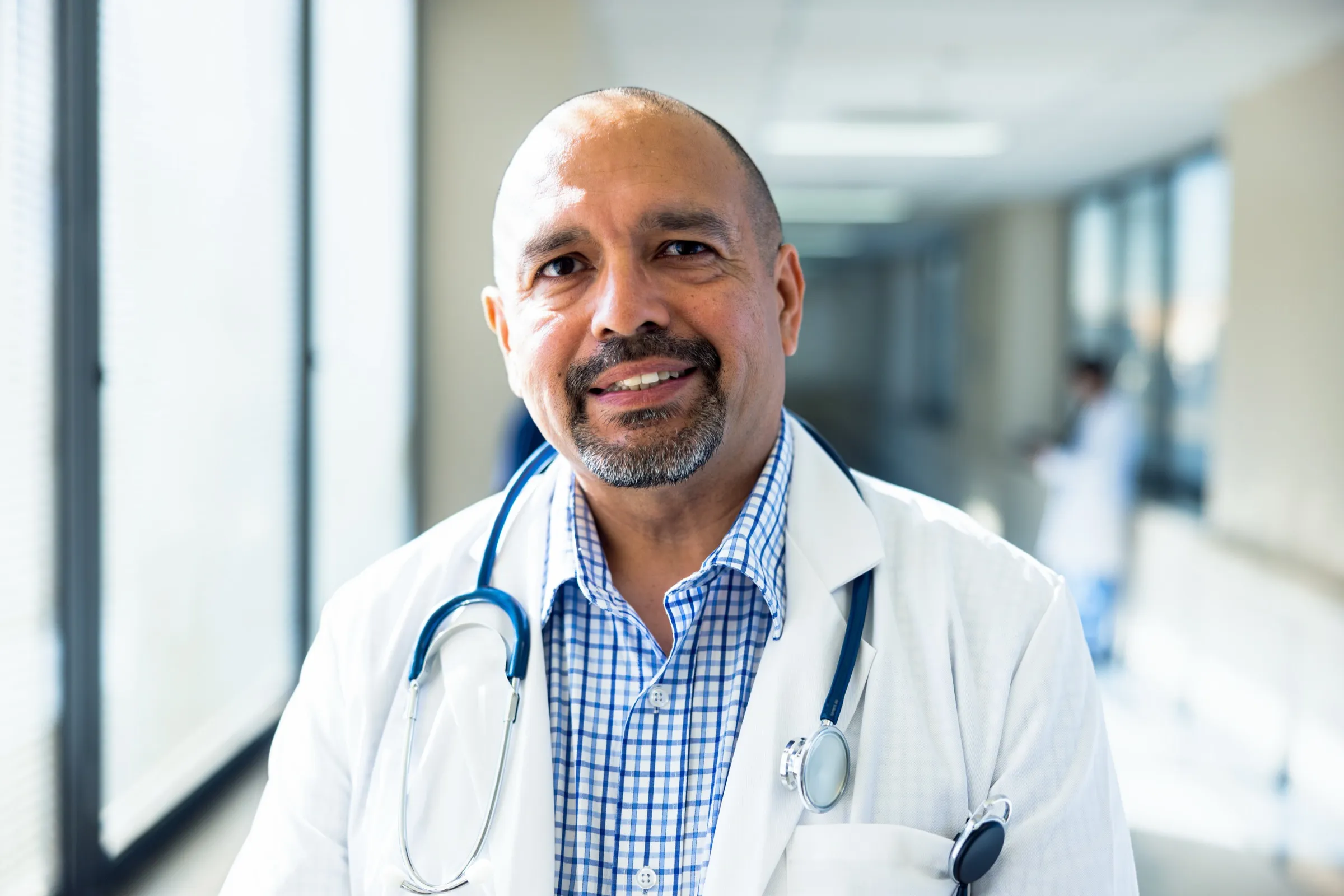 Physician standing in a hospital corridor