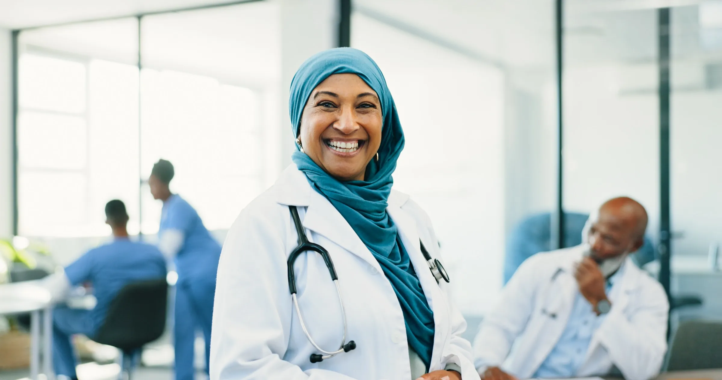 Physician standing in a hospital reception area