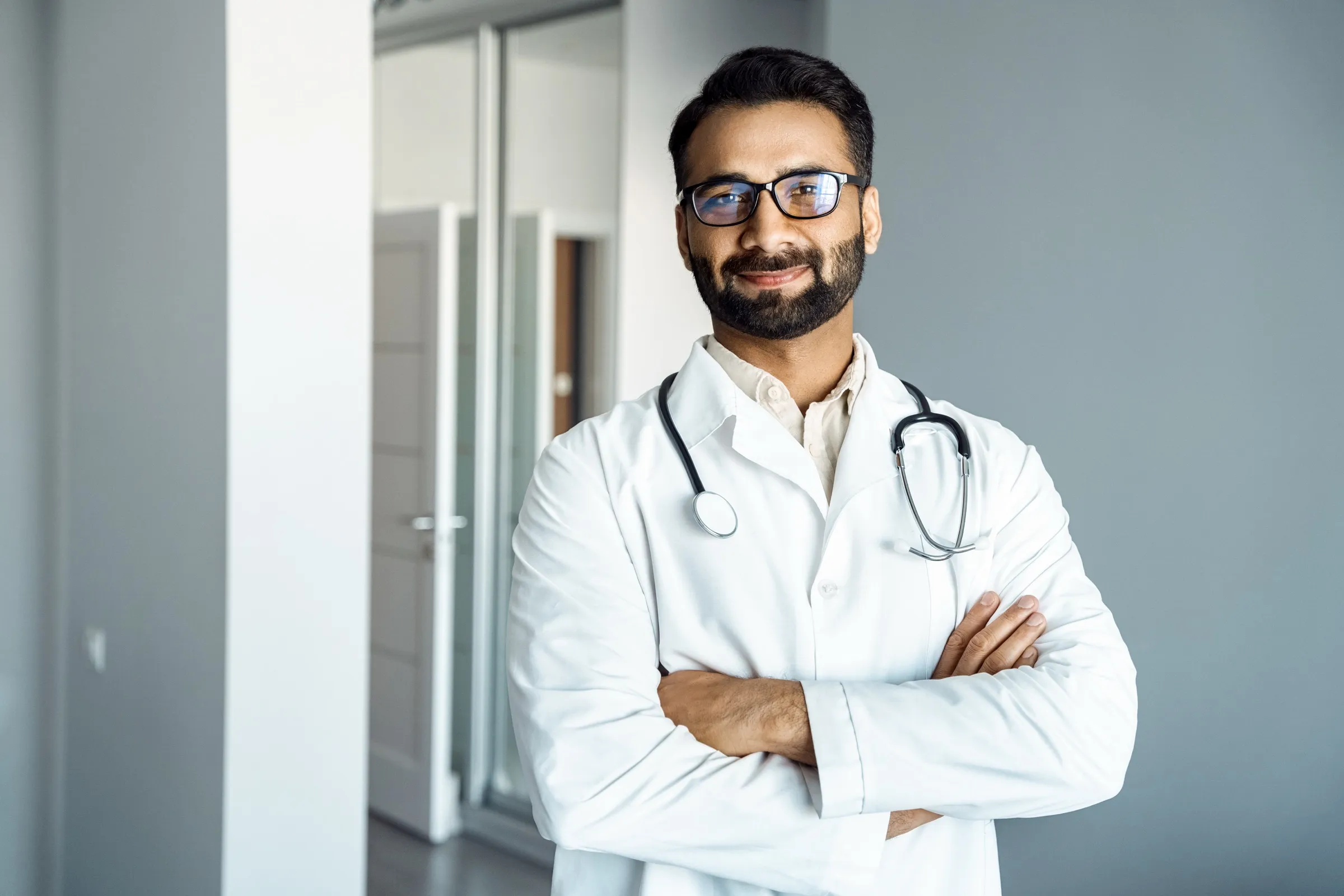 Physician standing in a hospital corridor