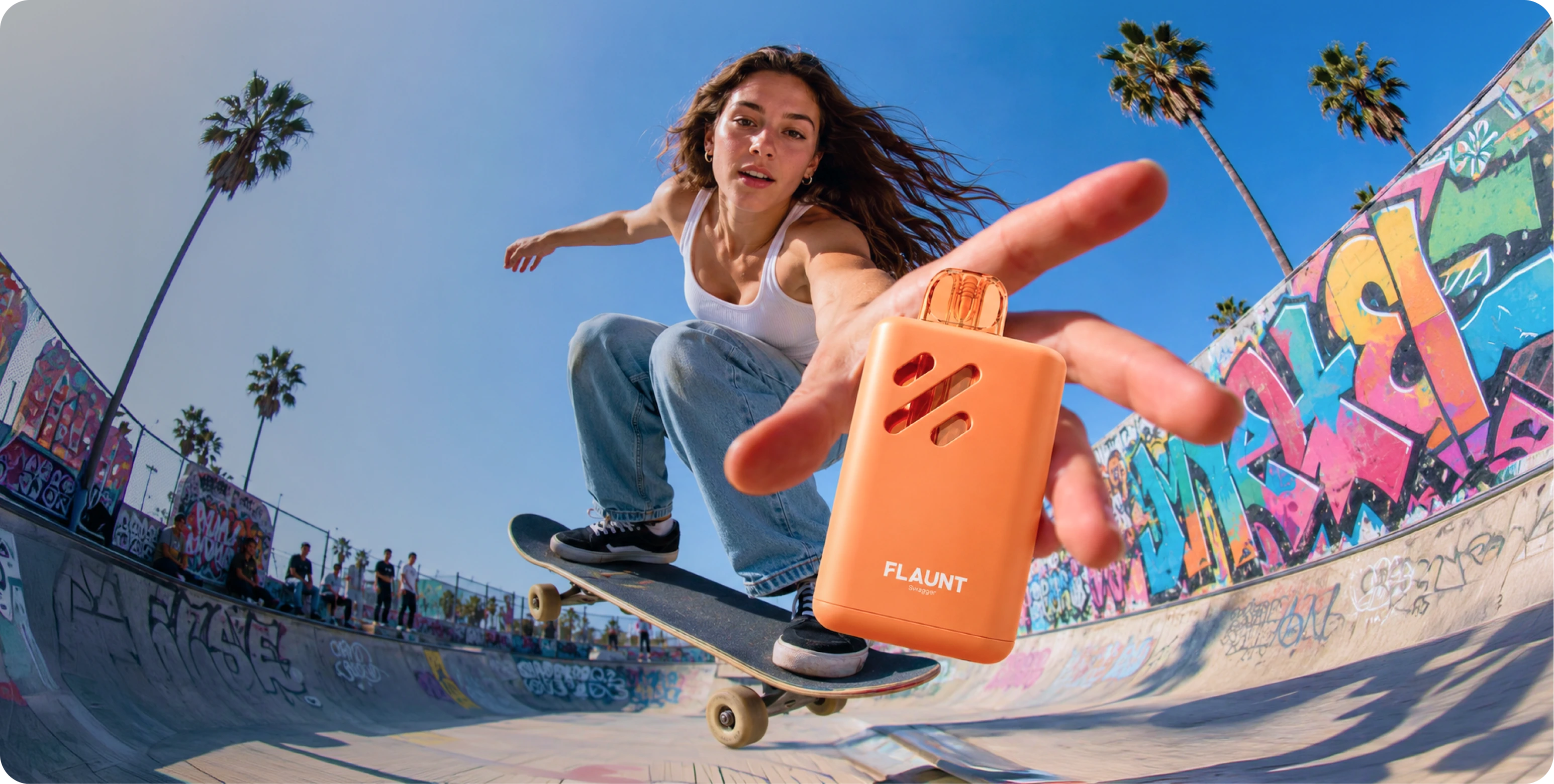 A skateboarder mid-trick at a graffiti-covered skate park