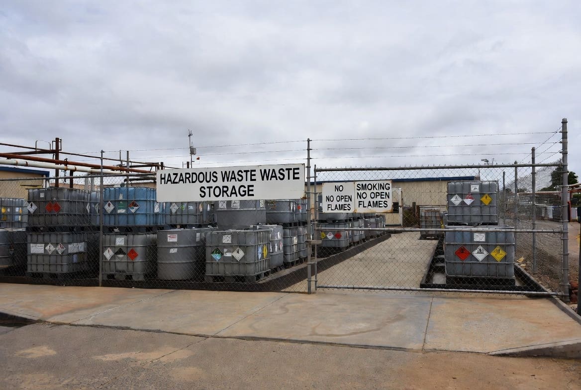 Properly segregated and labelled hazardous trash storage area at a South African industrial site