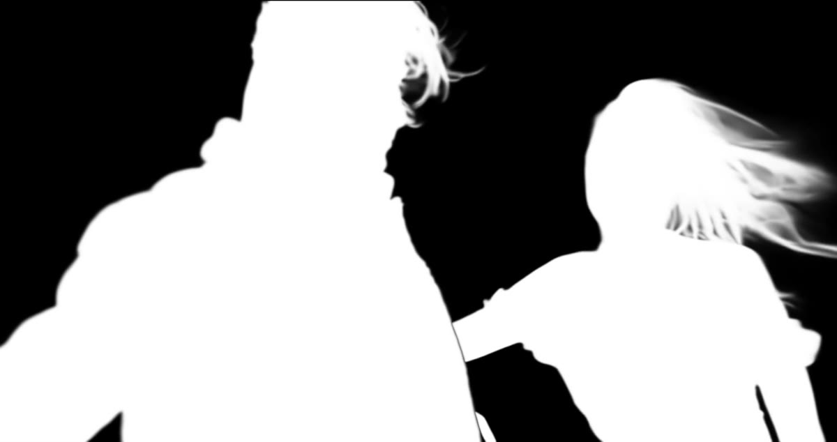 The Batch matte for the same frame: both people in white on black, hair strands included