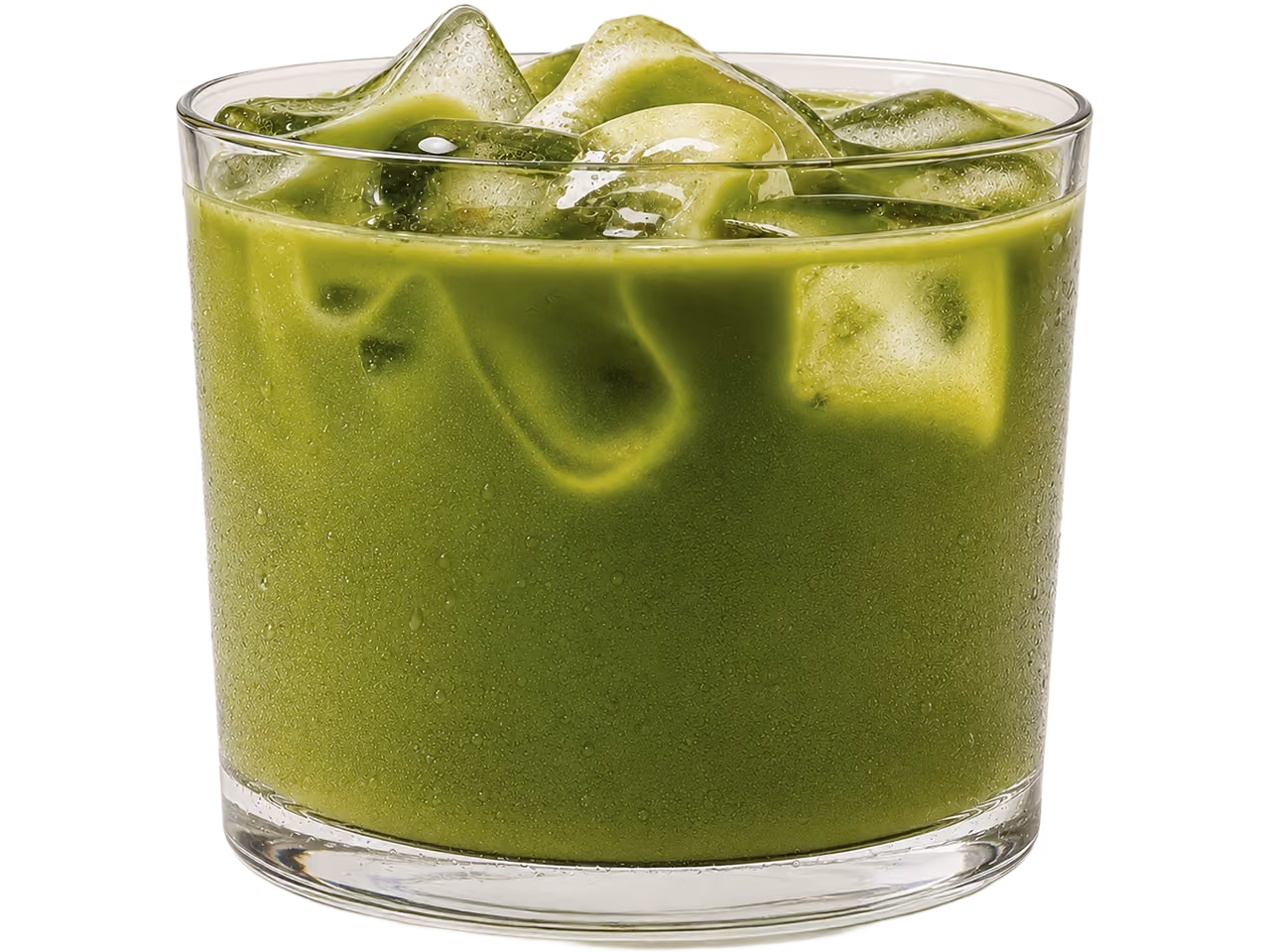Clear glass filled with iced green matcha tea, condensation on glass surface.