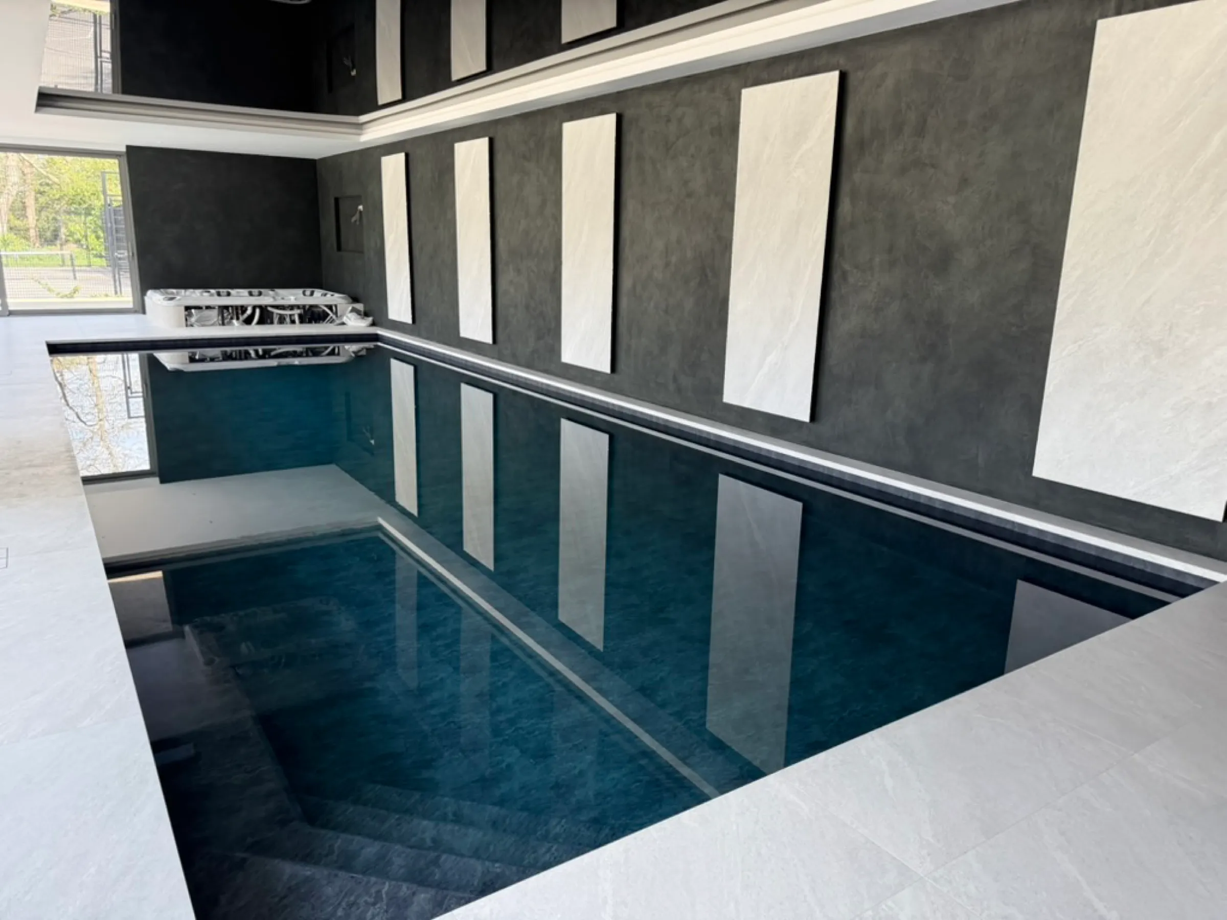 Completed dark-stone indoor pool