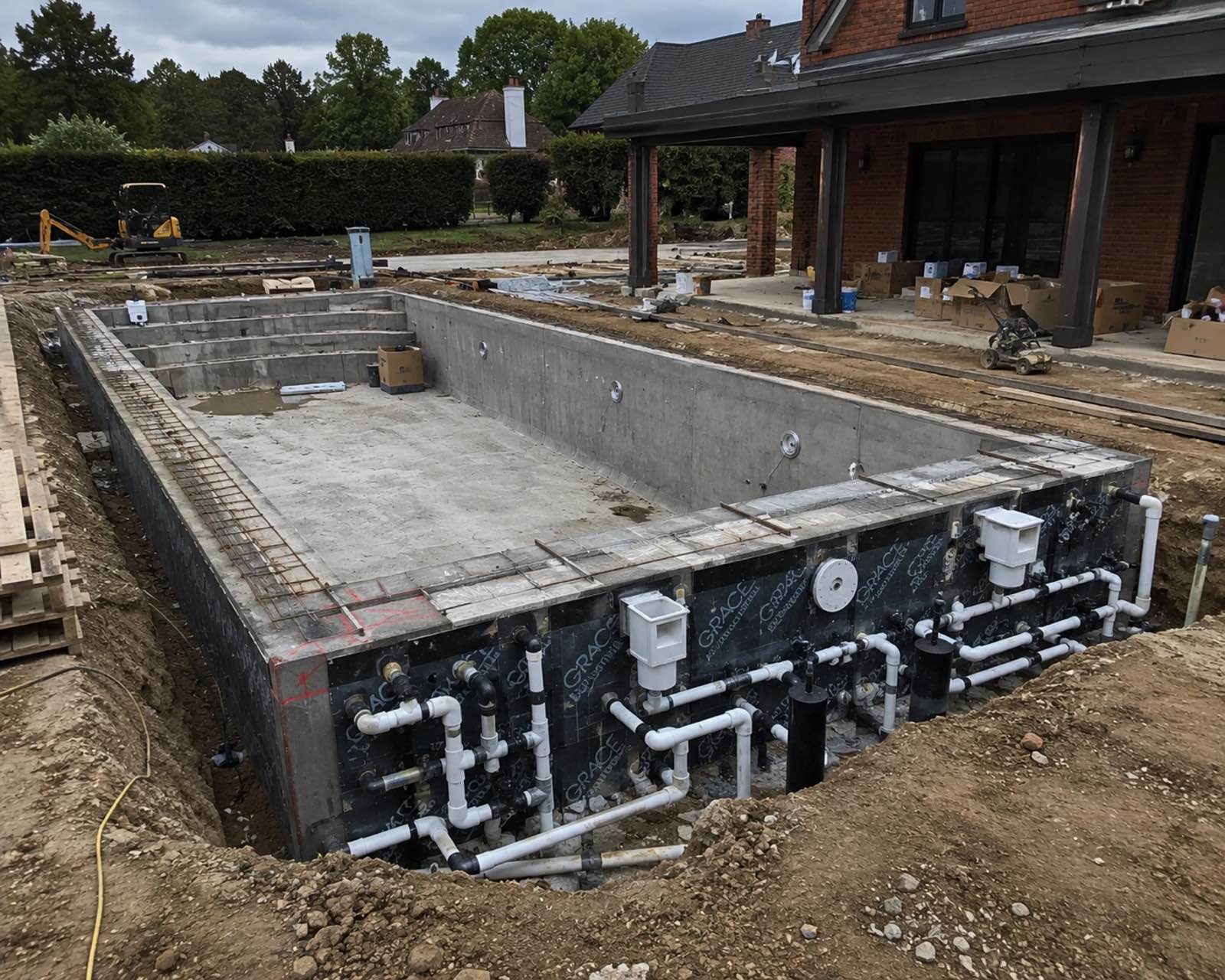 Pool shell mid-construction, concrete walls and waterproofing