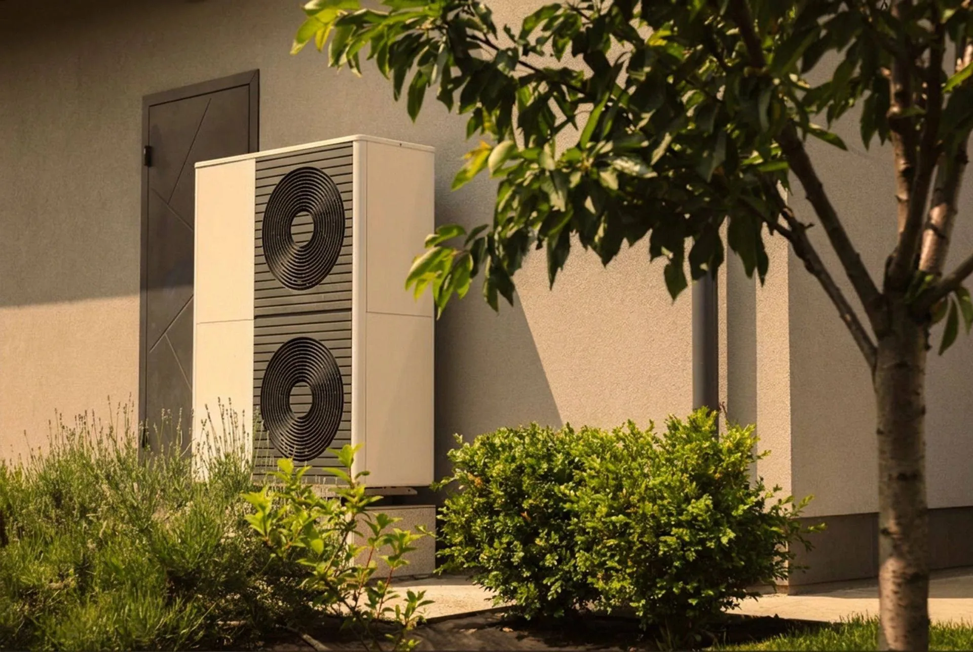 Air-source heat pump beside a house