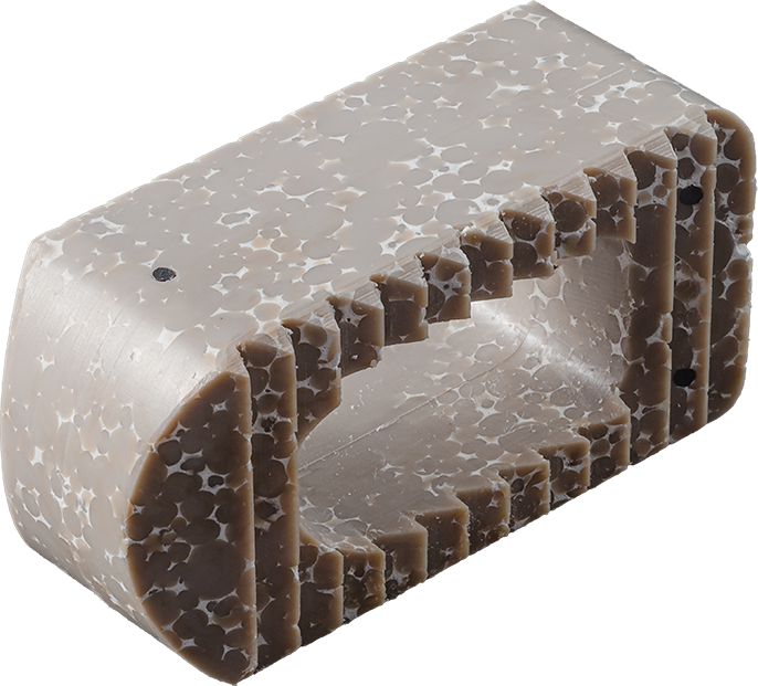 Cutaway rendering of HyperPEEK showing the internal structure of the biocomposite implant.