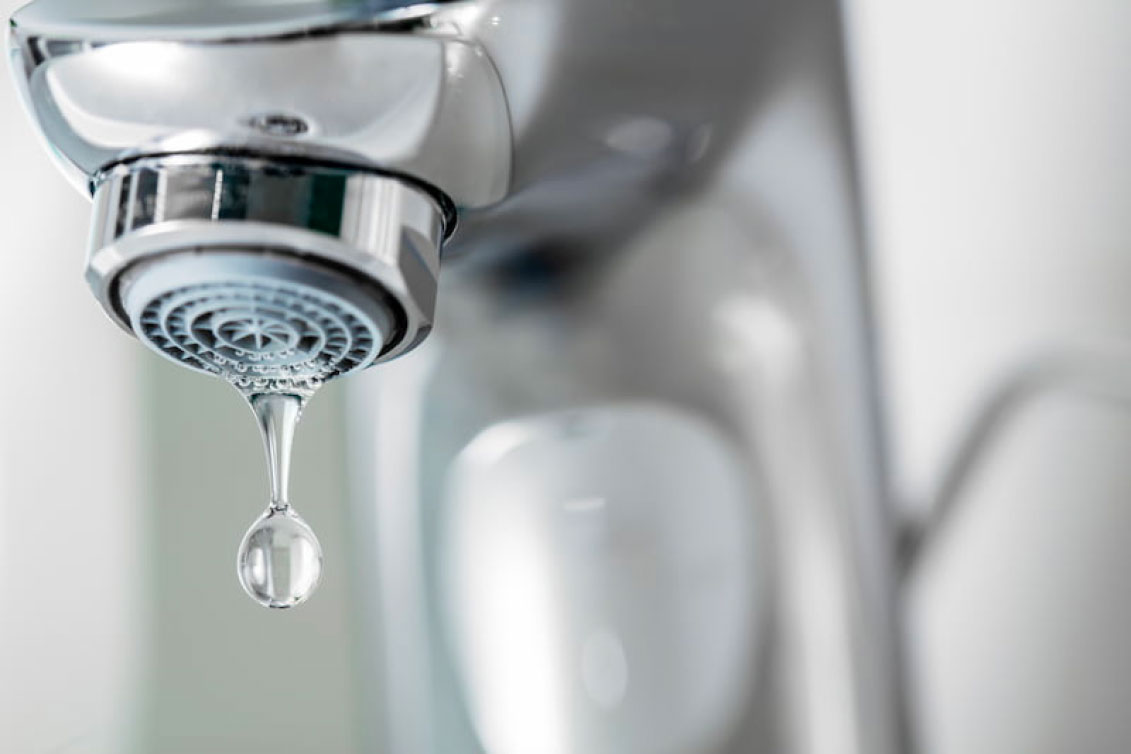 Water dripping from a low-flow faucet