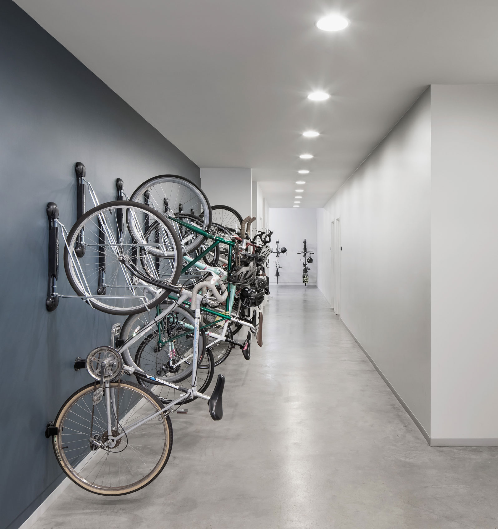Indoor bicycle storage with wall-mounted bikes