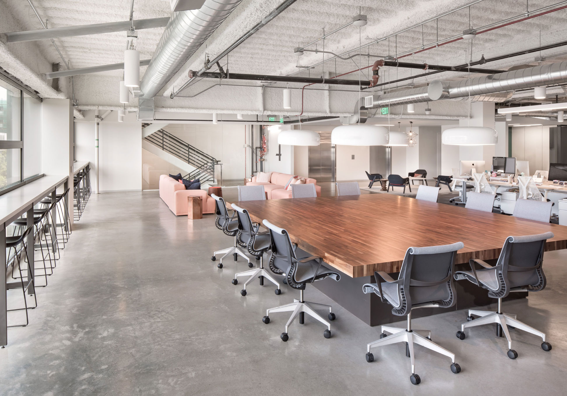 Open office meeting table and lounge seating