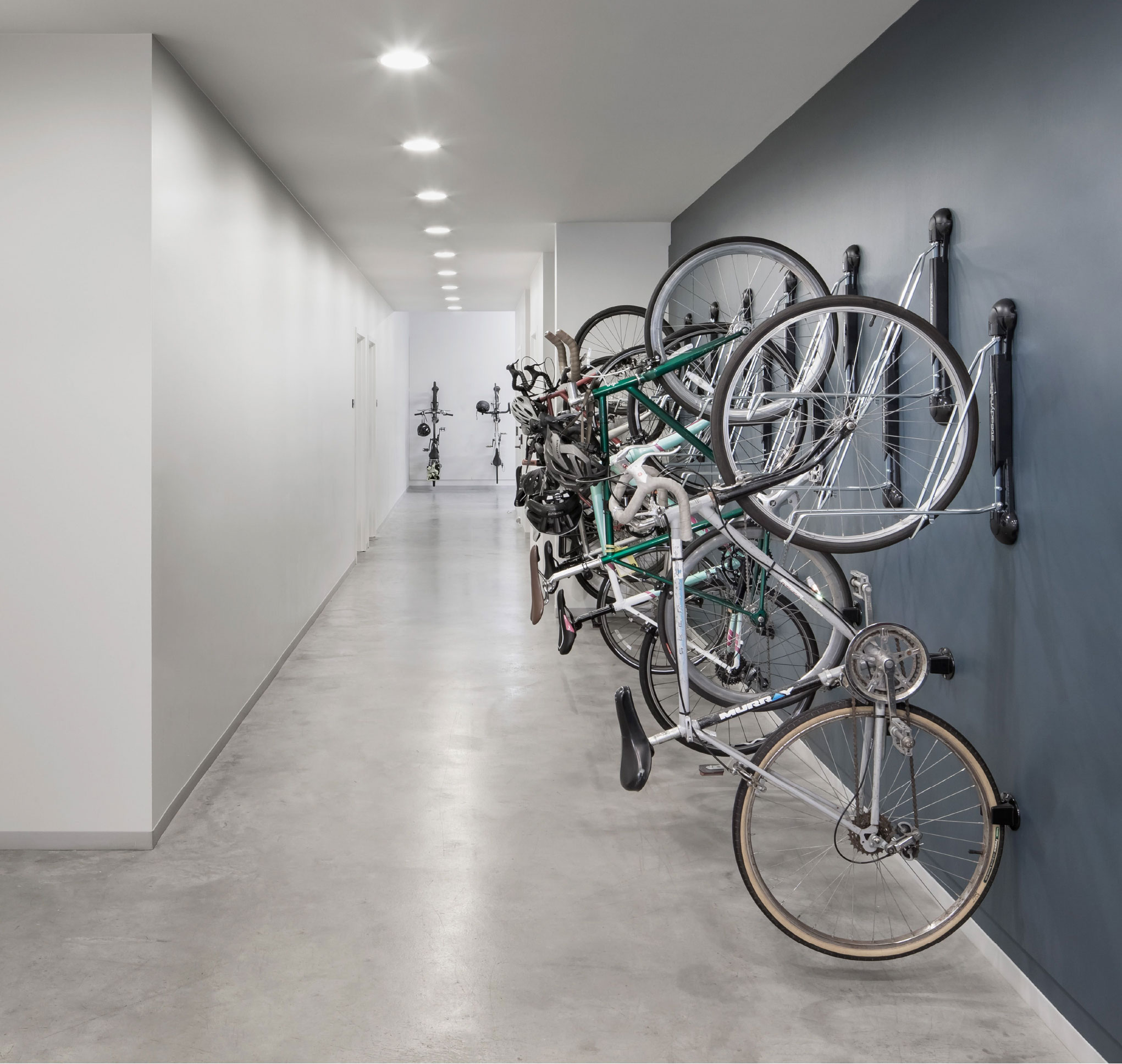 Indoor bicycle storage with wall-mounted bikes