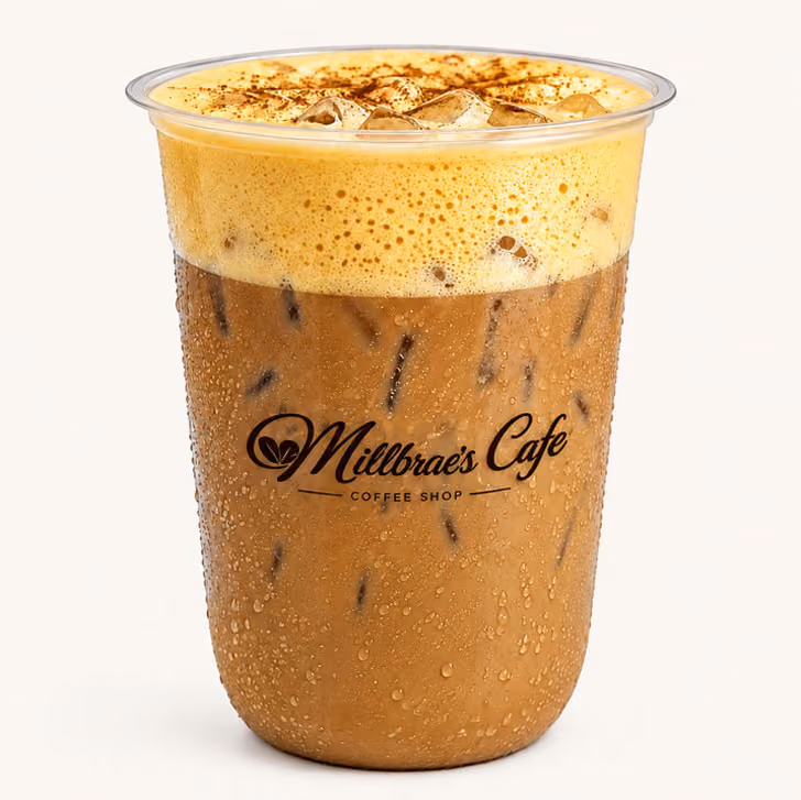 A cup of coffee with a foamy top.