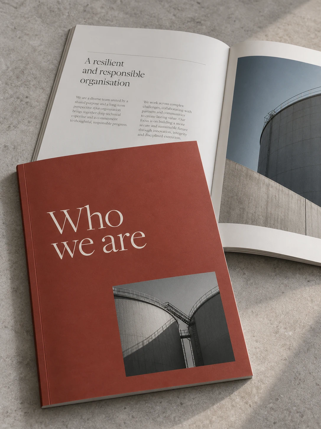 Brick-red company profile booklet with an open organisation overview
