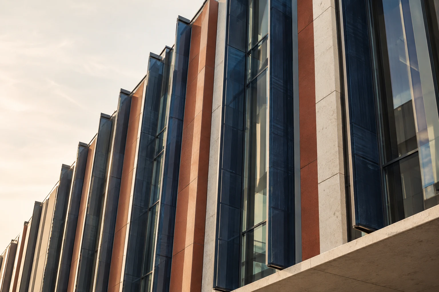 Navy glass and terracotta panels on a contemporary energy research building