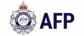 Australian Federal Police emblem with crown and laurel leaves next to AFP text.
