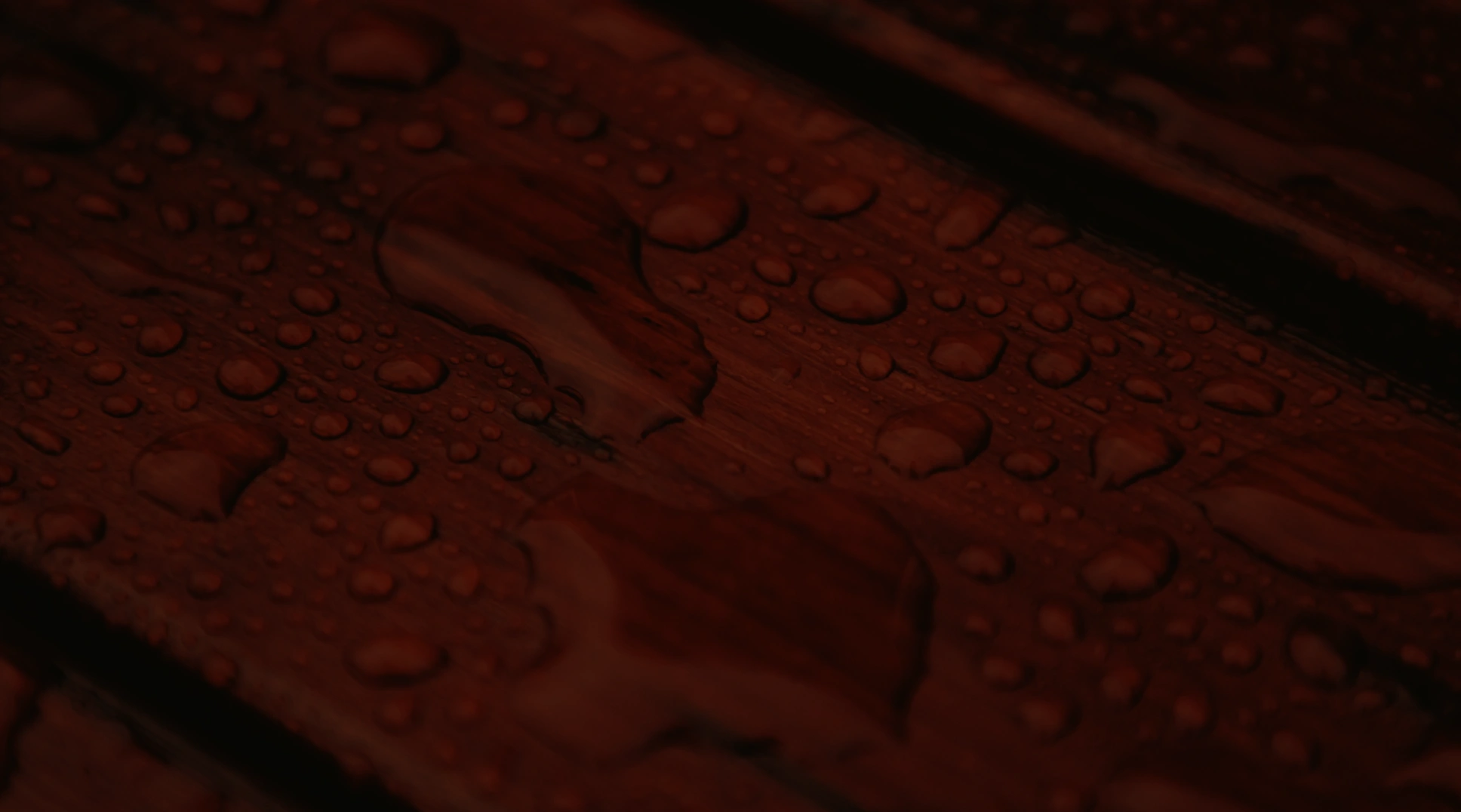water drops on stained wood
