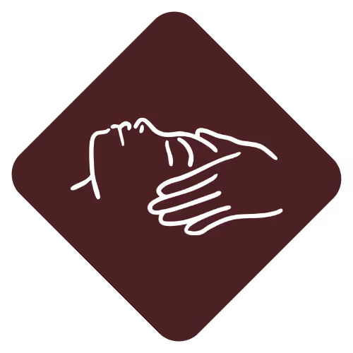 Brown asterisk symbol with rounded ends on a white background.
