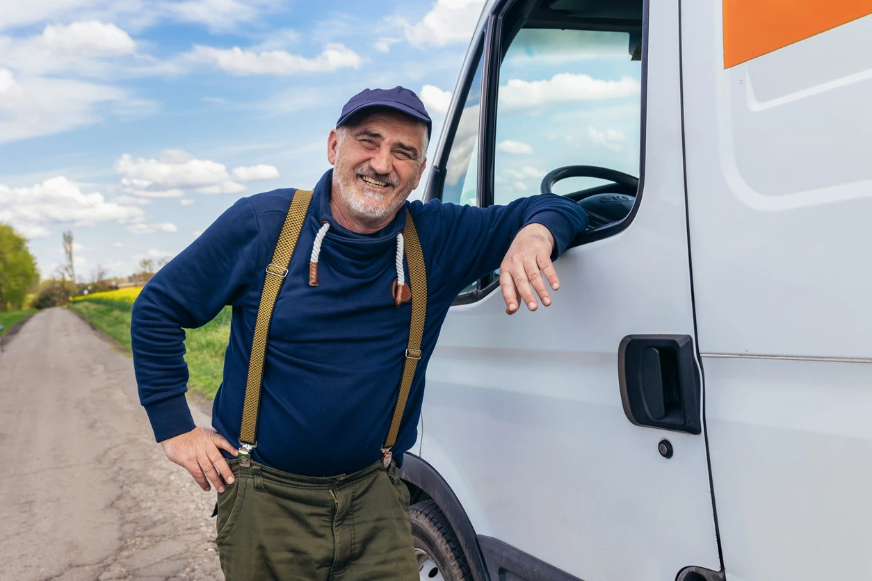 man standing by delivery truck