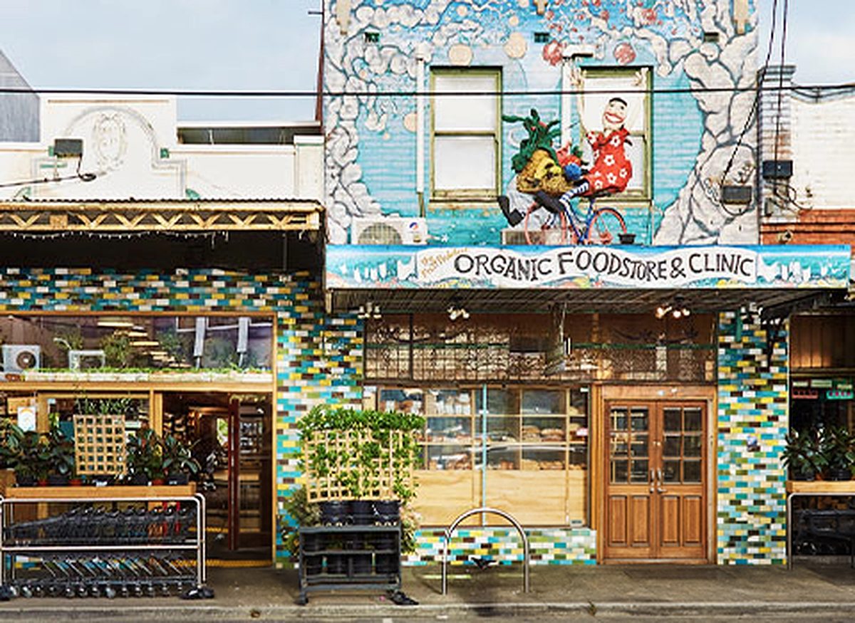 The Northcote shopfront on High St — its facade painted with a mural.