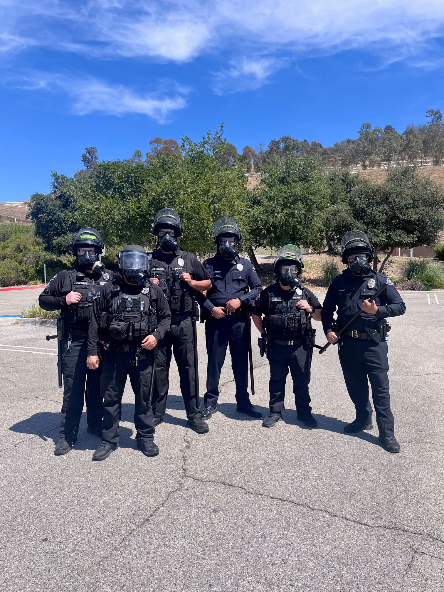 Sierra Madre Police tactical team members in gear standing together outdoors