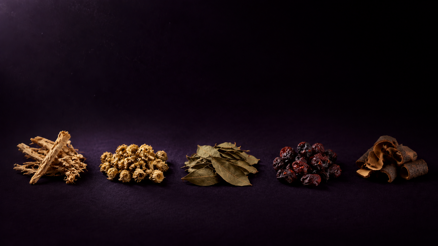 Five separate groupings of dried botanicals arranged in an arc