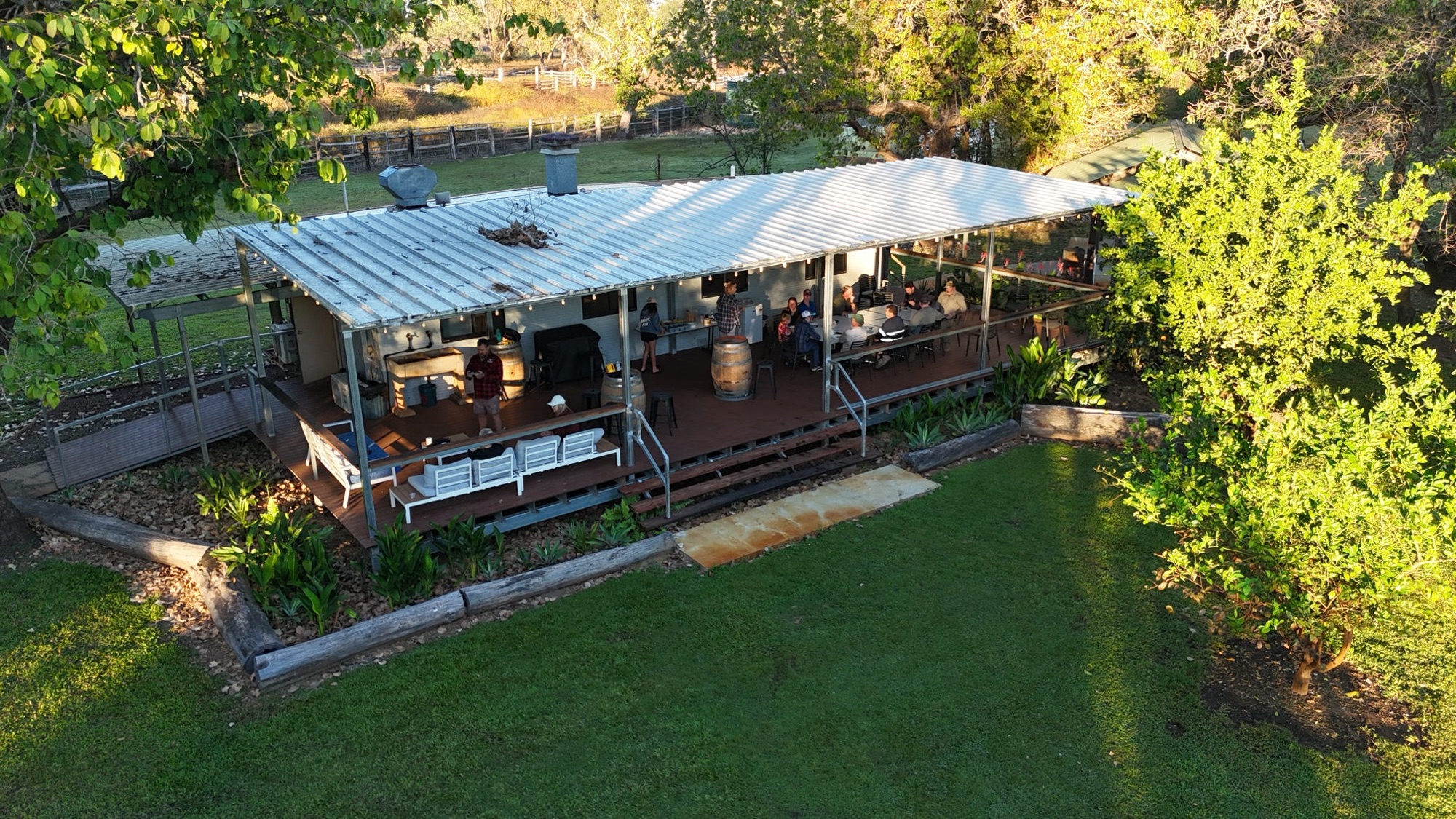 The station homestead and its wide verandah in evening light