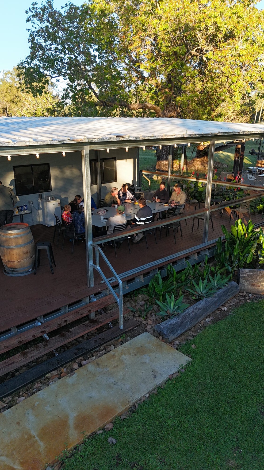 Guests sitting out on the homestead verandah