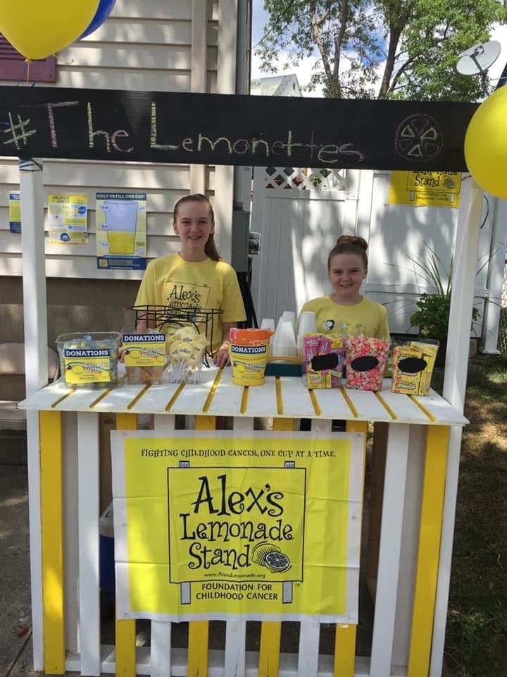 The stand a few years on, with balloons and the hashtag sign
