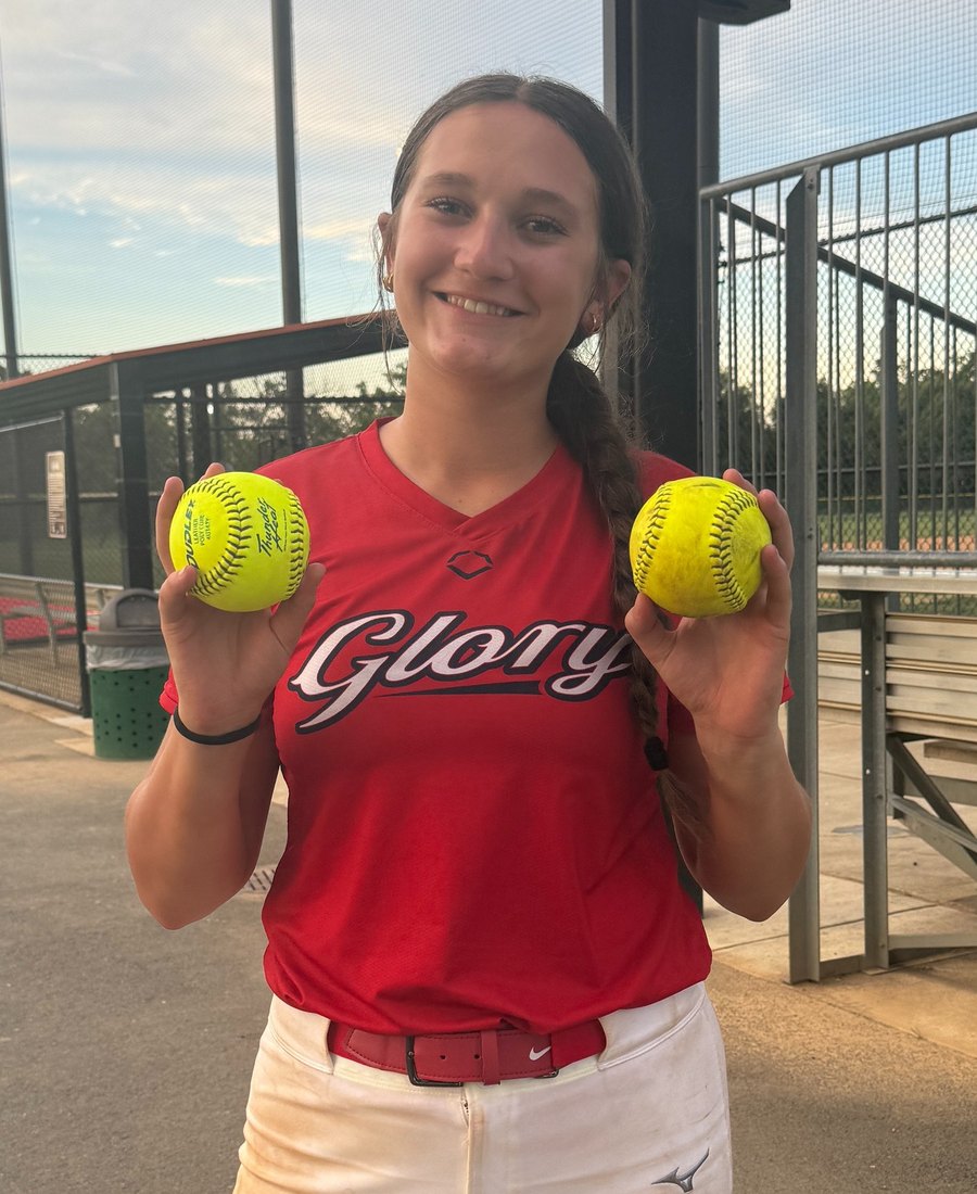 Payton Cascio holding two game balls after a two home run game