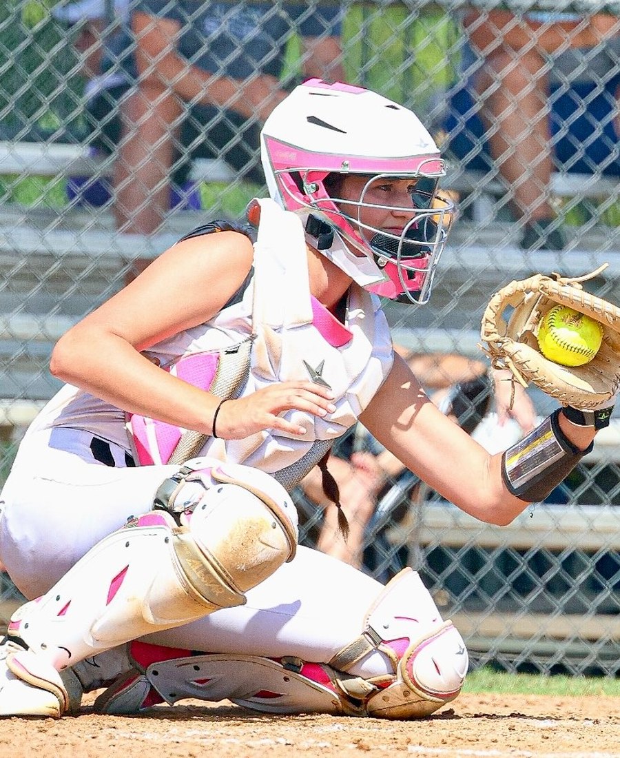 Payton Cascio framing a pitch behind the plate in full catcher's gear