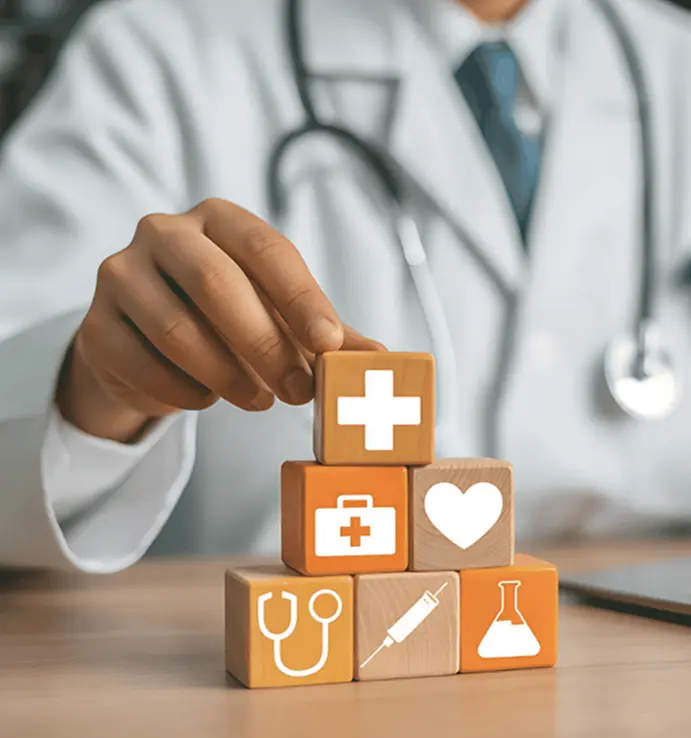 closeup doctor stacking content cubes on desk