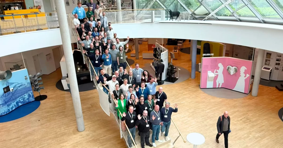 CMS Summit 26 attendees gathered on the stairs at the Museum für Kommunikation