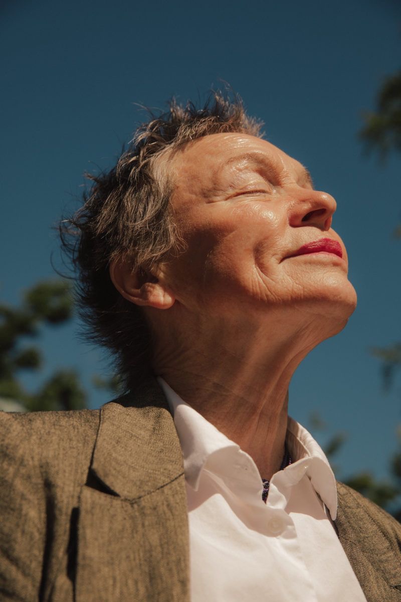 A woman outdoors; illustrative menopause care image
