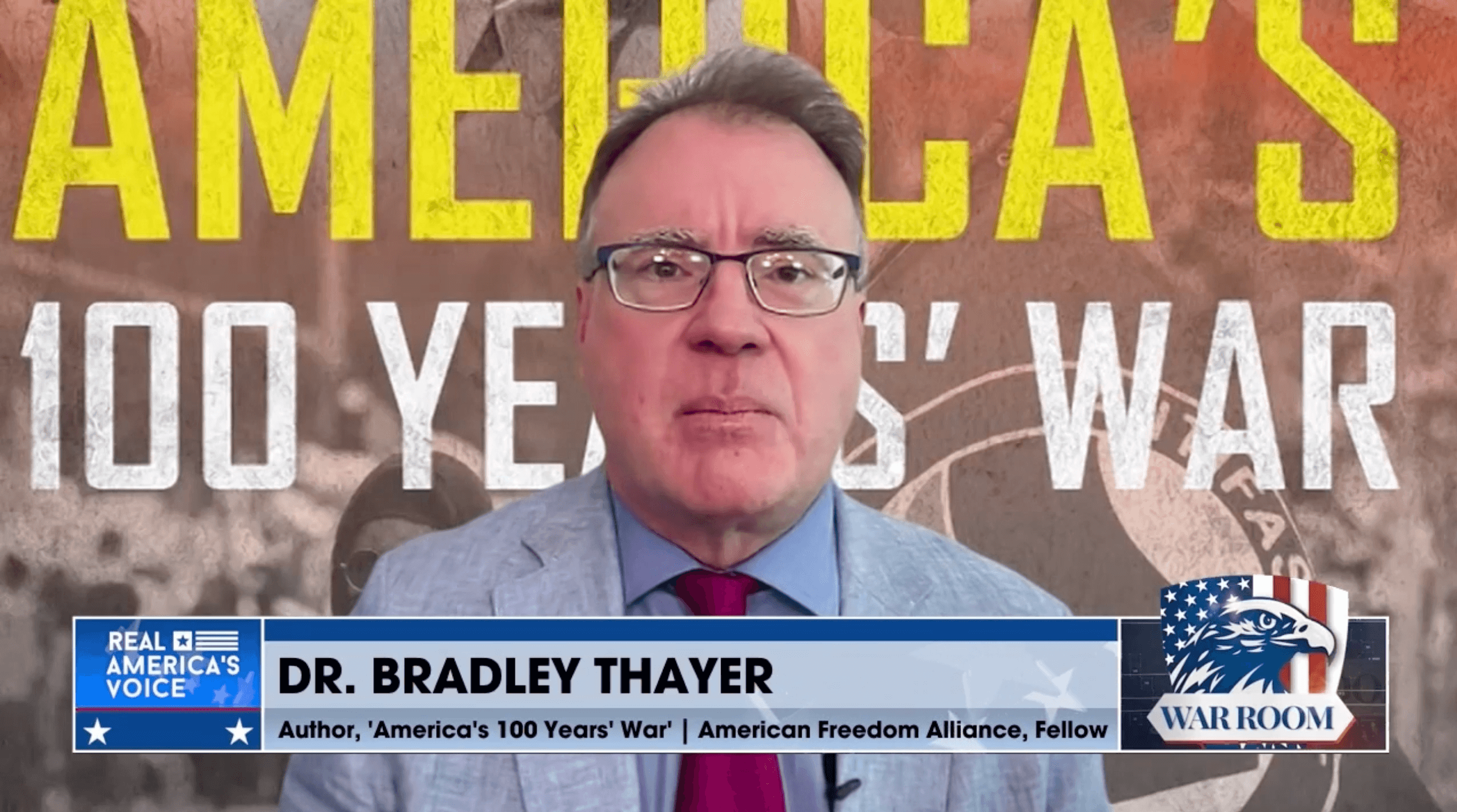 Dr. Bradley Thayer speaking on War Room with an America’s 100 Years’ War backdrop.