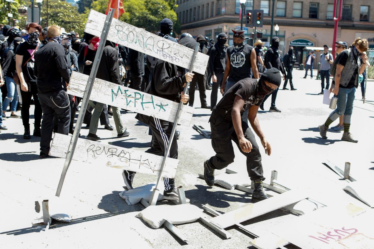 Antifa militants and counter-protesters marching in downtown Berkeley, California.