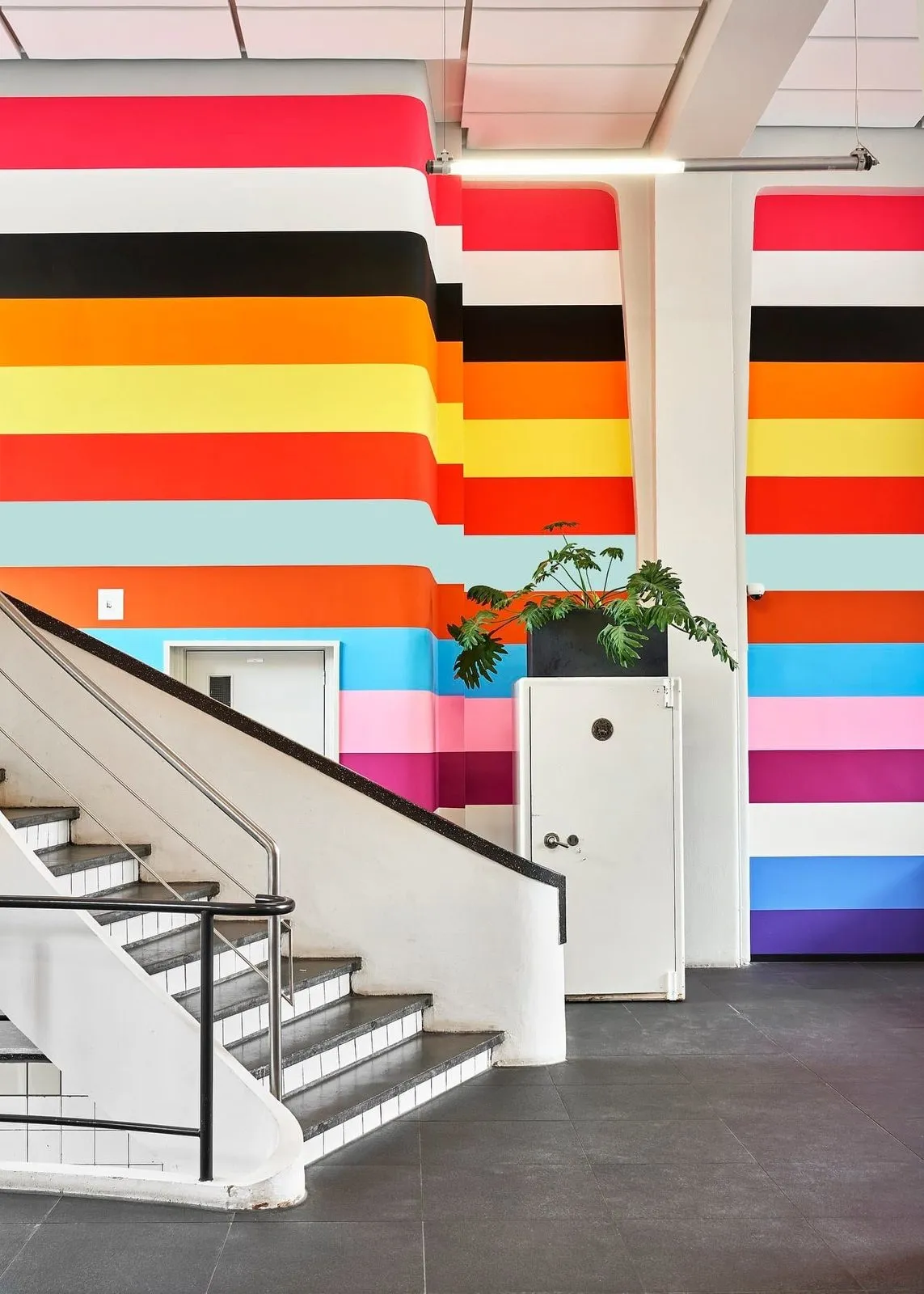 Colourful striped stairwell in the Tiledmedia office in Rotterdam
