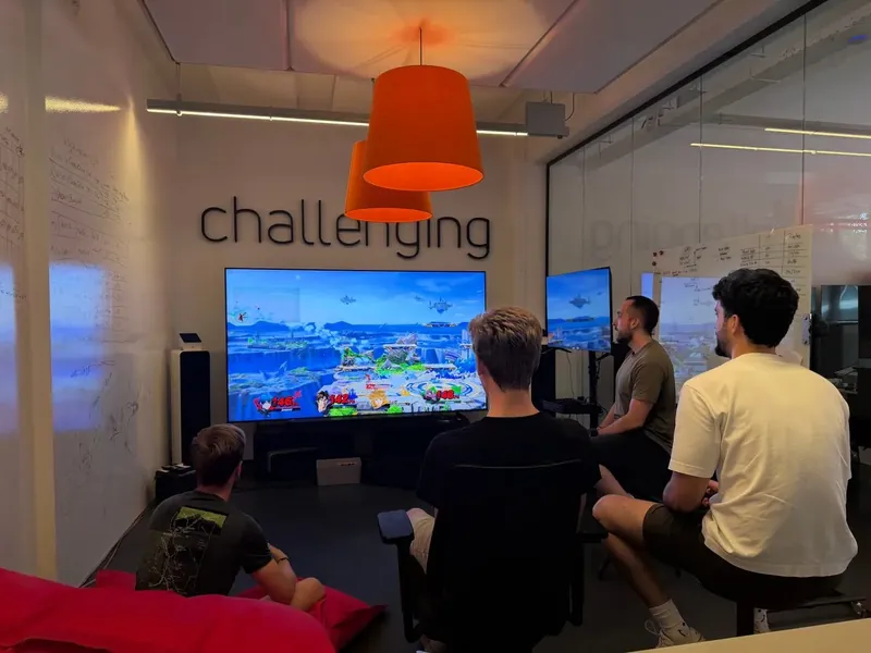 Team playing a game together in the Tiledmedia lounge