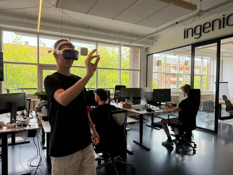Colleague testing a VR headset at the Tiledmedia office