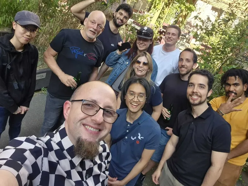 Group selfie of the Tiledmedia team outdoors