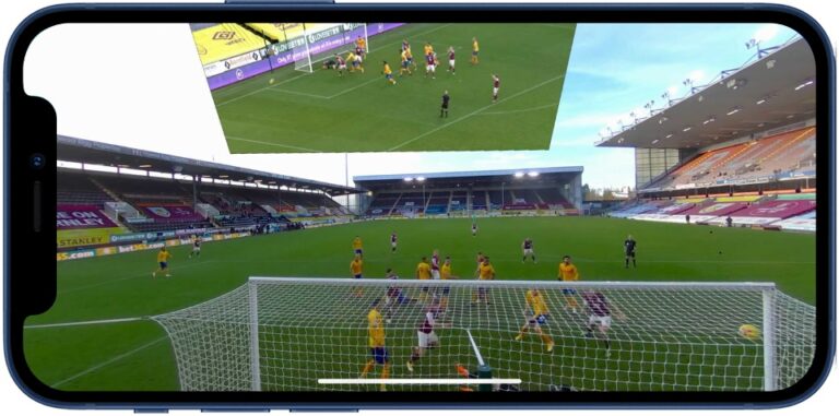 Phone showing a football match with a second camera angle beside it