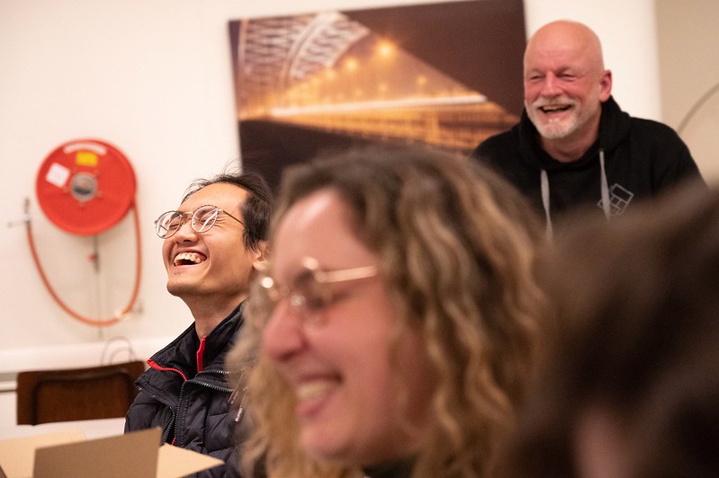 Colleagues laughing together during the Sinterklaas celebration