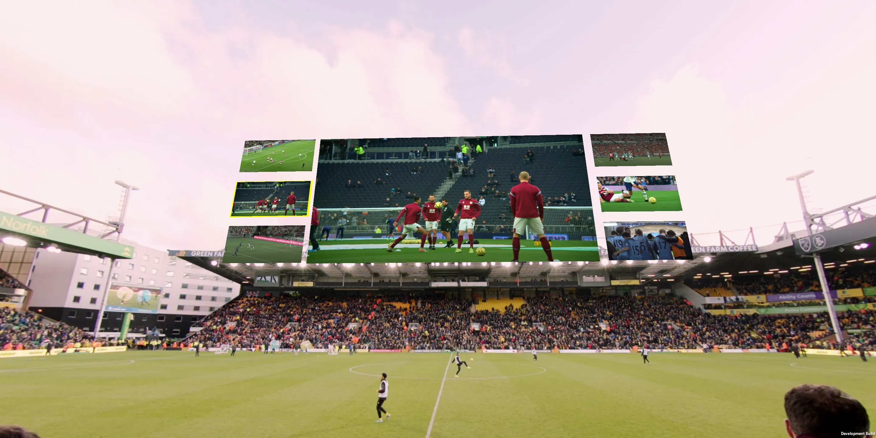 VR view from the stands with a large screen showing the match