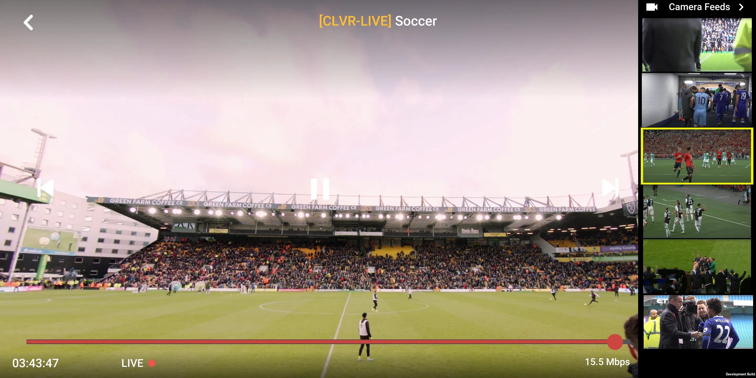 Flat-screen multiview of a football match from a stand-level camera, extra feeds beside it