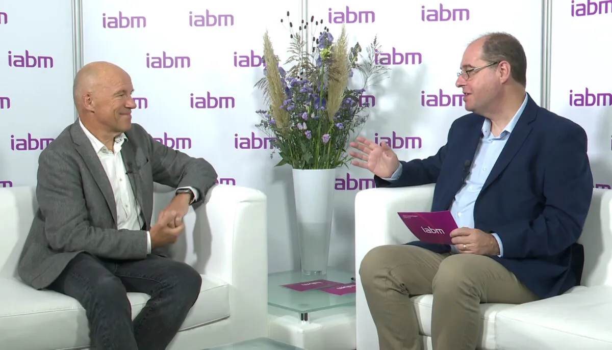Rob Koenen being interviewed by IABM in front of a branded backdrop