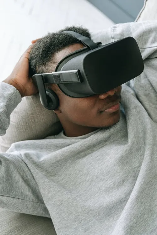 Person lying back while wearing a VR headset