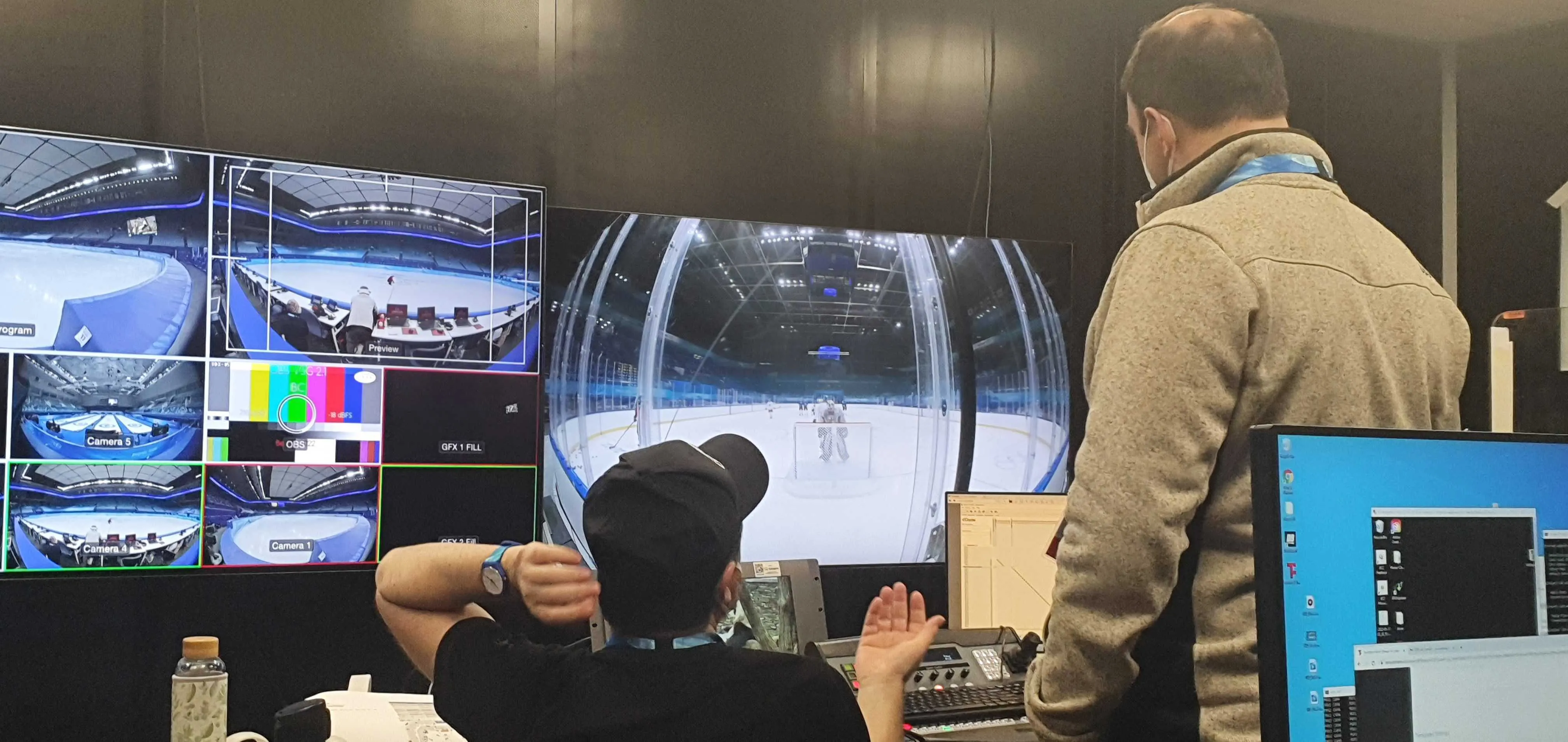 VR production room in Beijing with monitors showing the stadium feeds