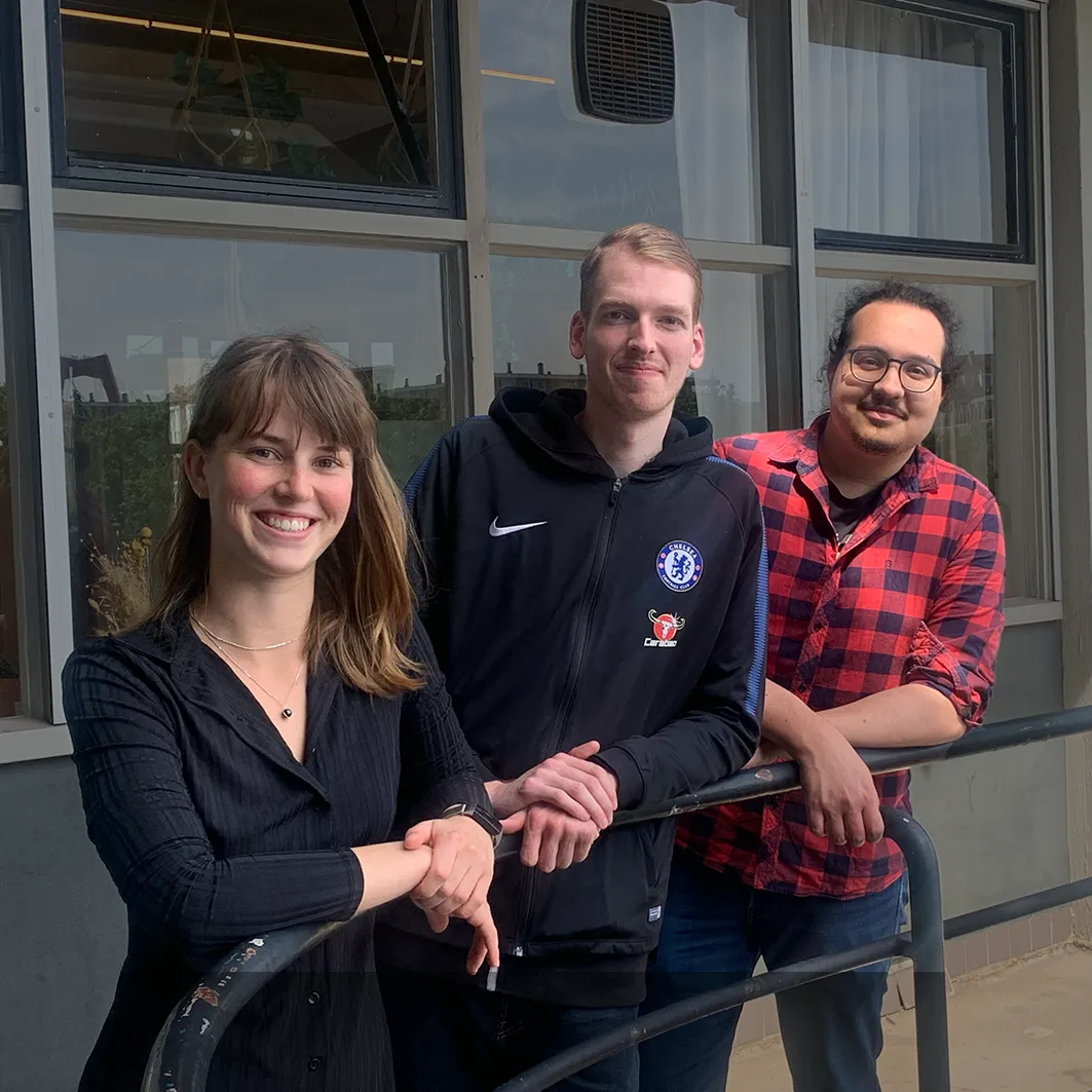 Tiledmedia's three new interns together outside the office